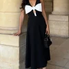 Primrose | Black Plunge-Neck Midi Dress With White Bow